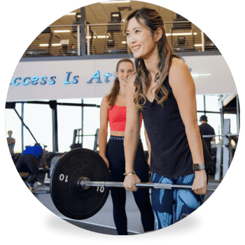 Woman lifting weights in a workout customized for her